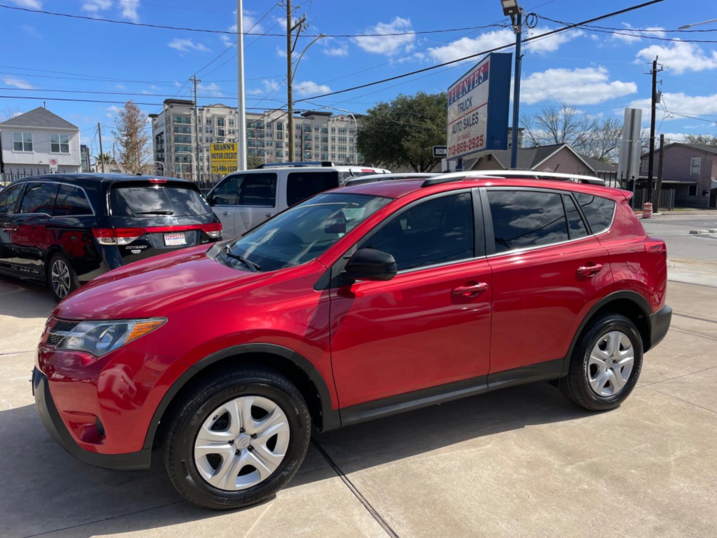 2013 Red /Silver Toyota RAV4 LE (2T3ZFREV0DW) with an 2.5L engine, Automatic transmission, located at 1501 West 15th St., Houston, 77008, (713) 869-2925, 29.797941, -95.411789 - Photo#0